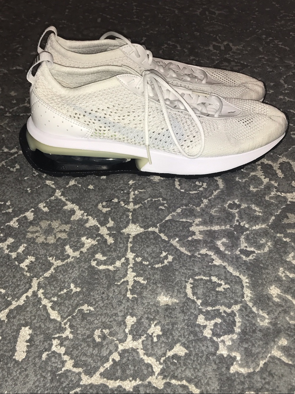 White Knit Nike Sneakers with Black Sole Accent